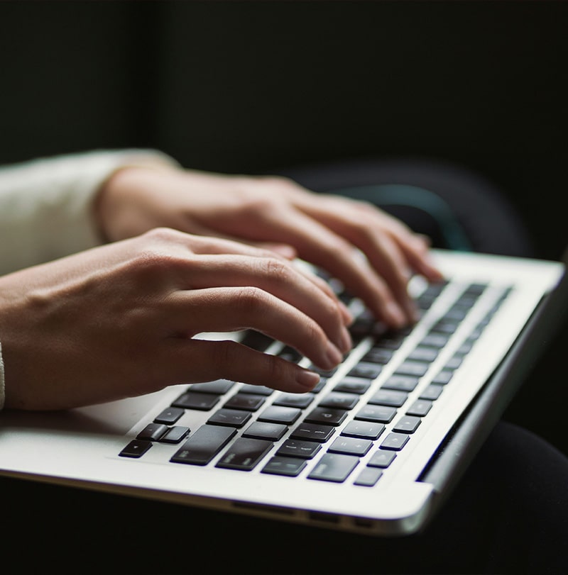 Person typing on a laptop